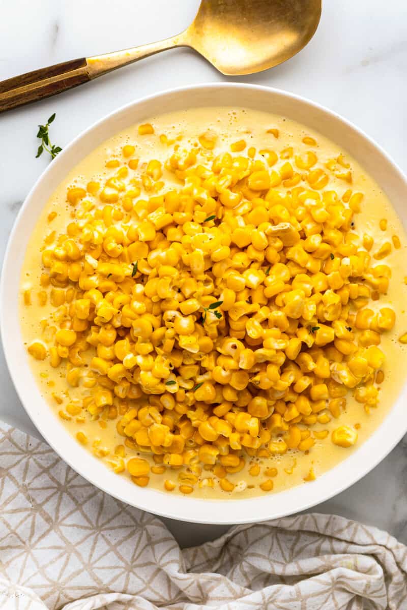 white glass bowl with creamed corn