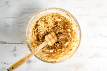 peanut butter pie filling in glass bowl with a spatula