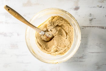 peanut butter pie filling in a glass bowl with a spatula