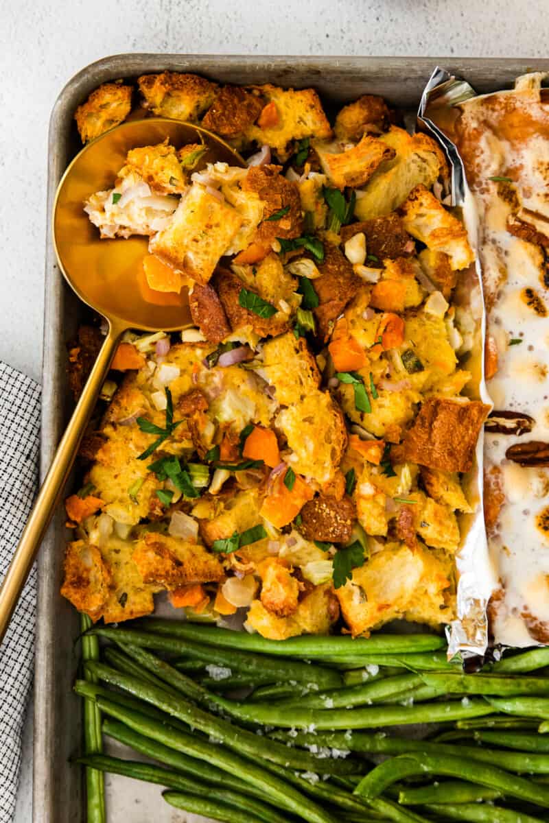 turkey dressing on a sheet pan with a serving spoon