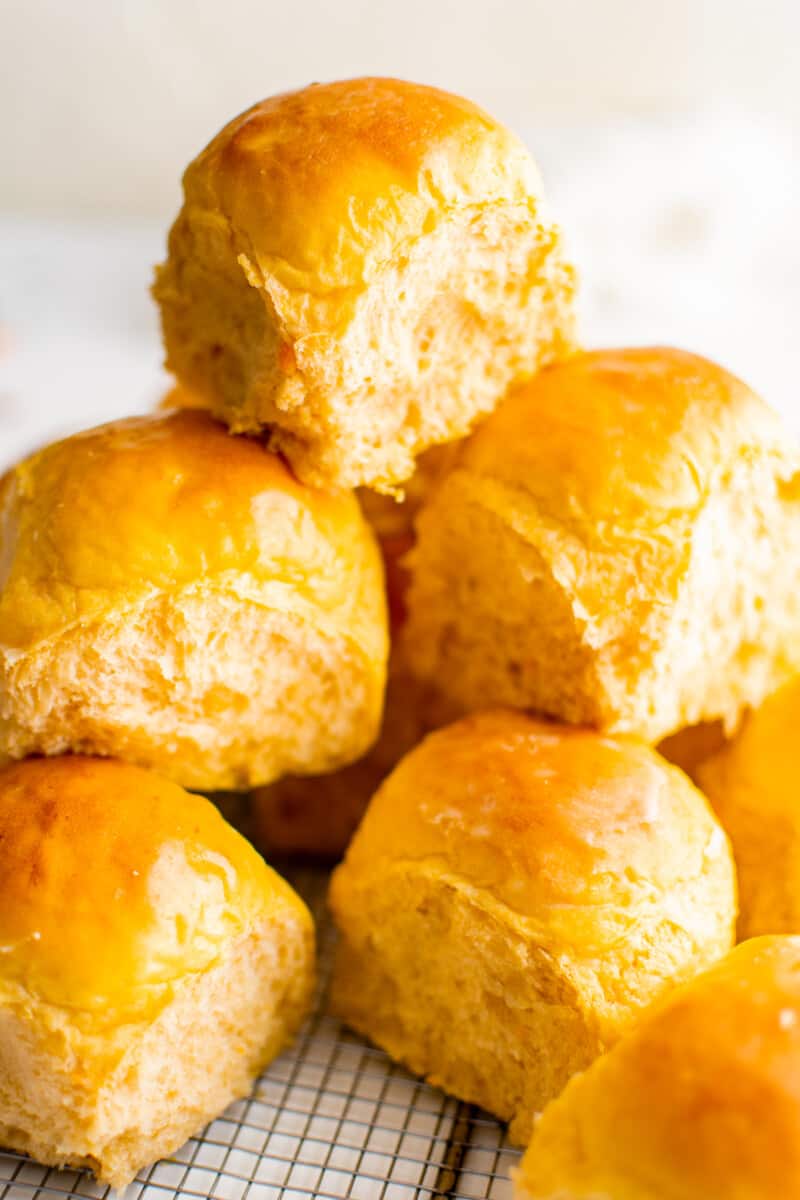 stack of sweet potato rolls on a cooling rack