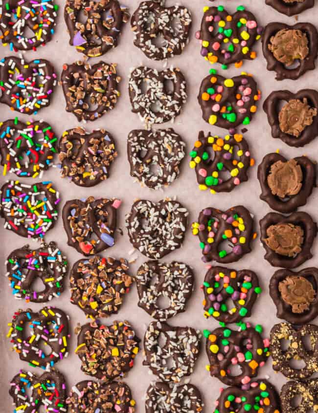 overhead image of chocolate covered pretzels with toppings