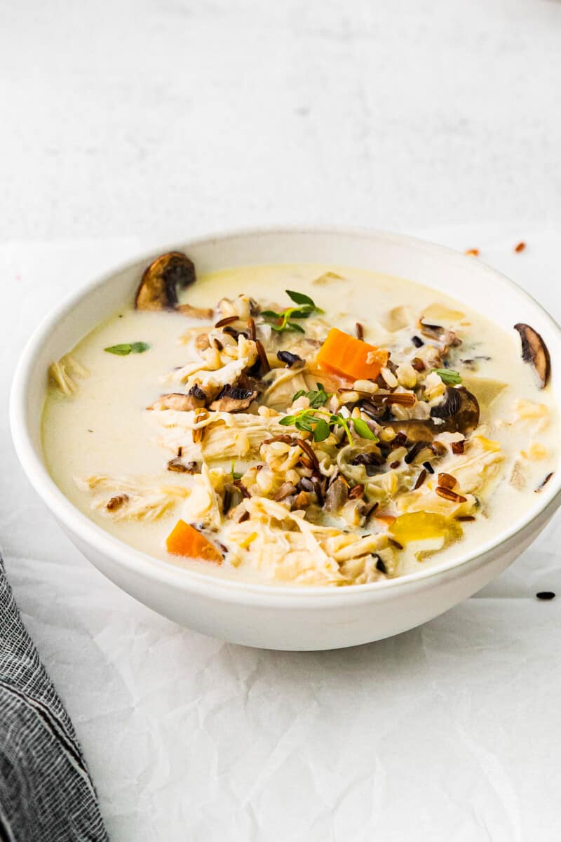 crockpot chicken wild rice soup in a white bowl