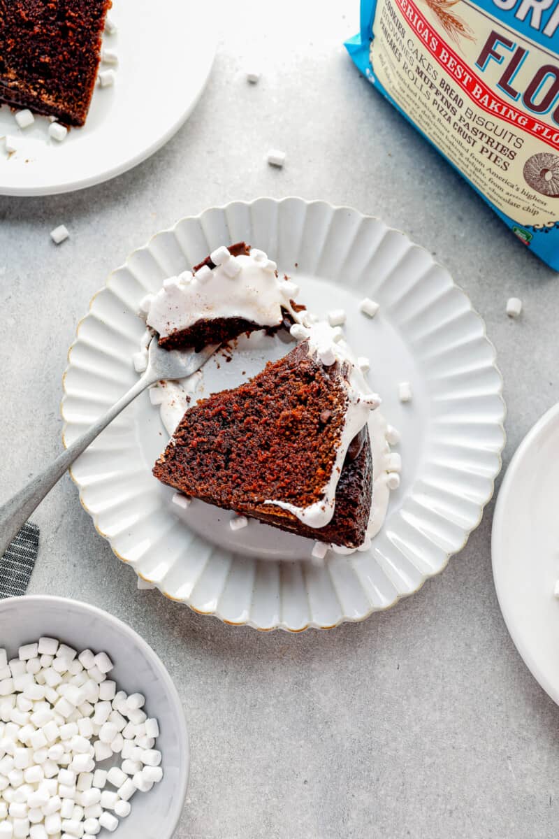 slice of hot chocolate bundt cake on a white plate with a fork