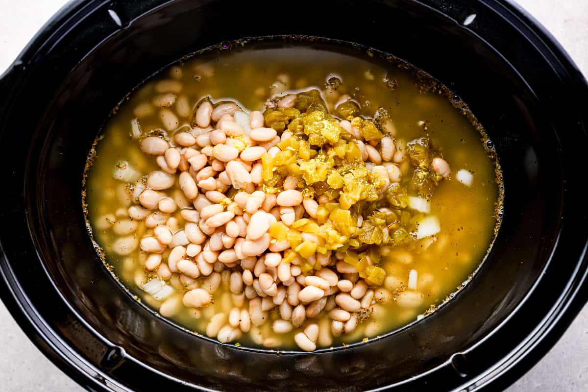 White bean chicken chili ingredients in a Crockpot.