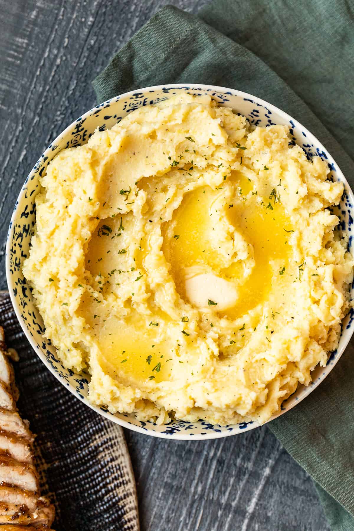 mashed potatoes in a bowl with butter on top