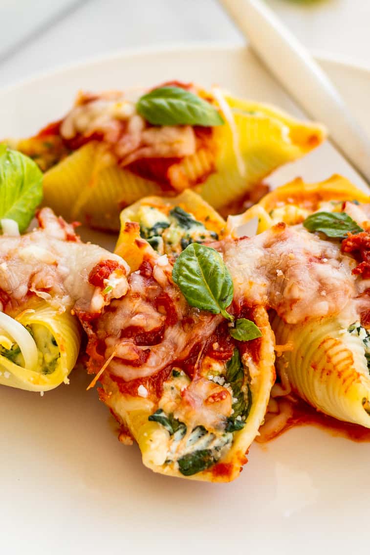 spinach stuffed shells on a plate.