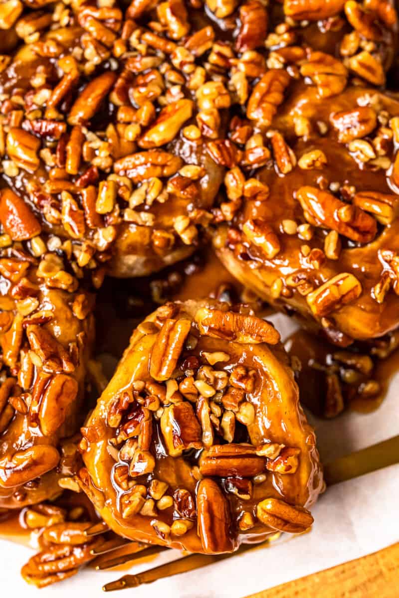 caramel pecan sticky buns on a white serving tray