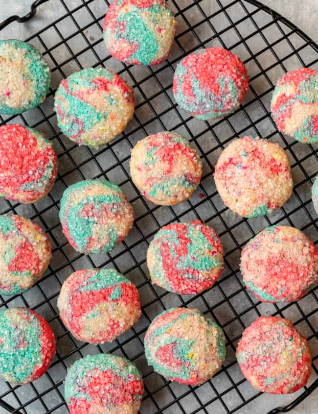 overhead image of tie dye cookies on a round cooling rack