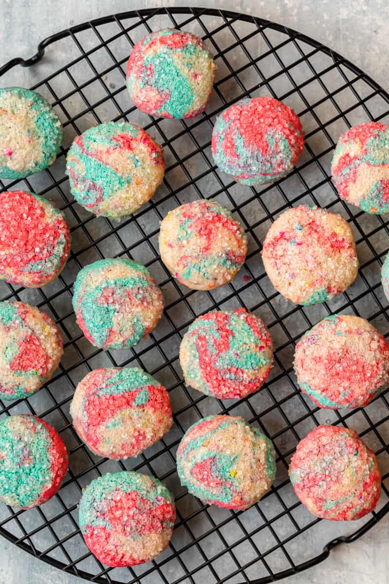 overhead image of tie dye cookies on a round cooling rack