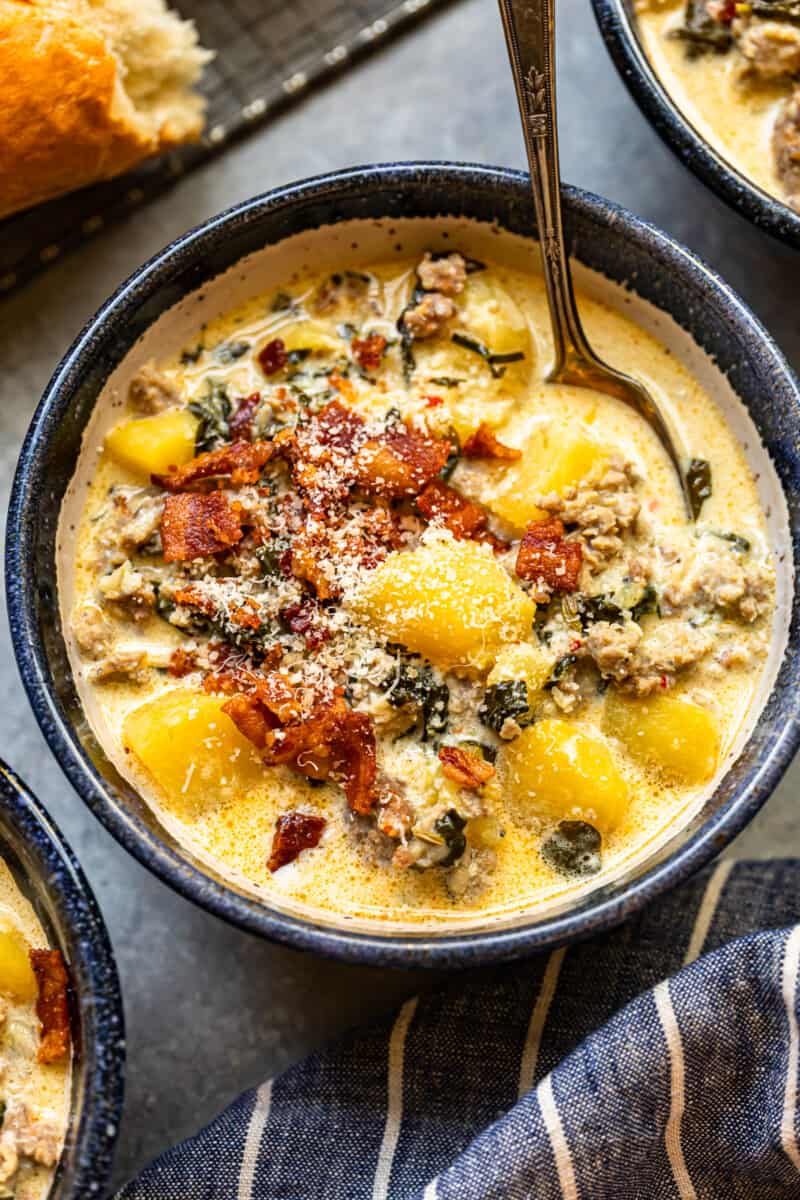 zuppa toscana soup in a bowl with a spoon