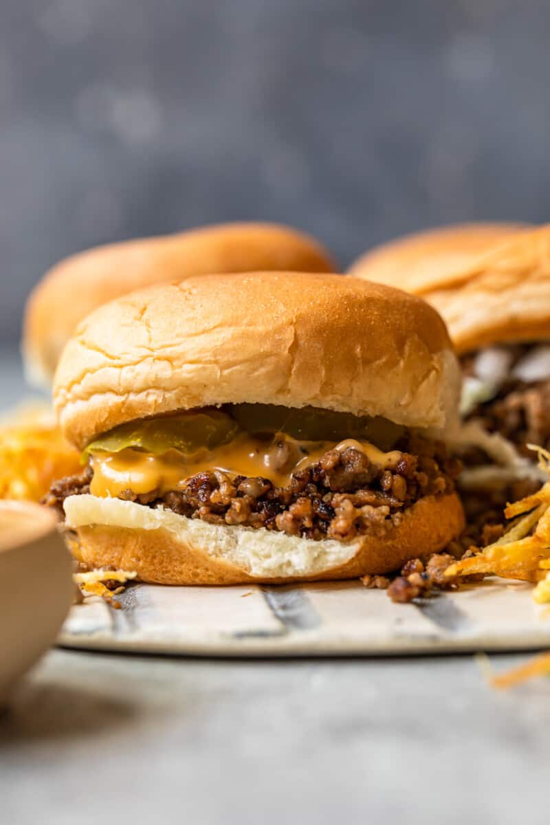 maid rite sandwiches topped with cheese and pickles