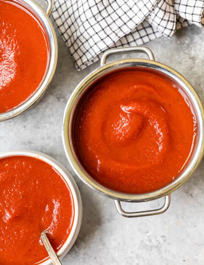 taco sauce in a pot and 2 bowls