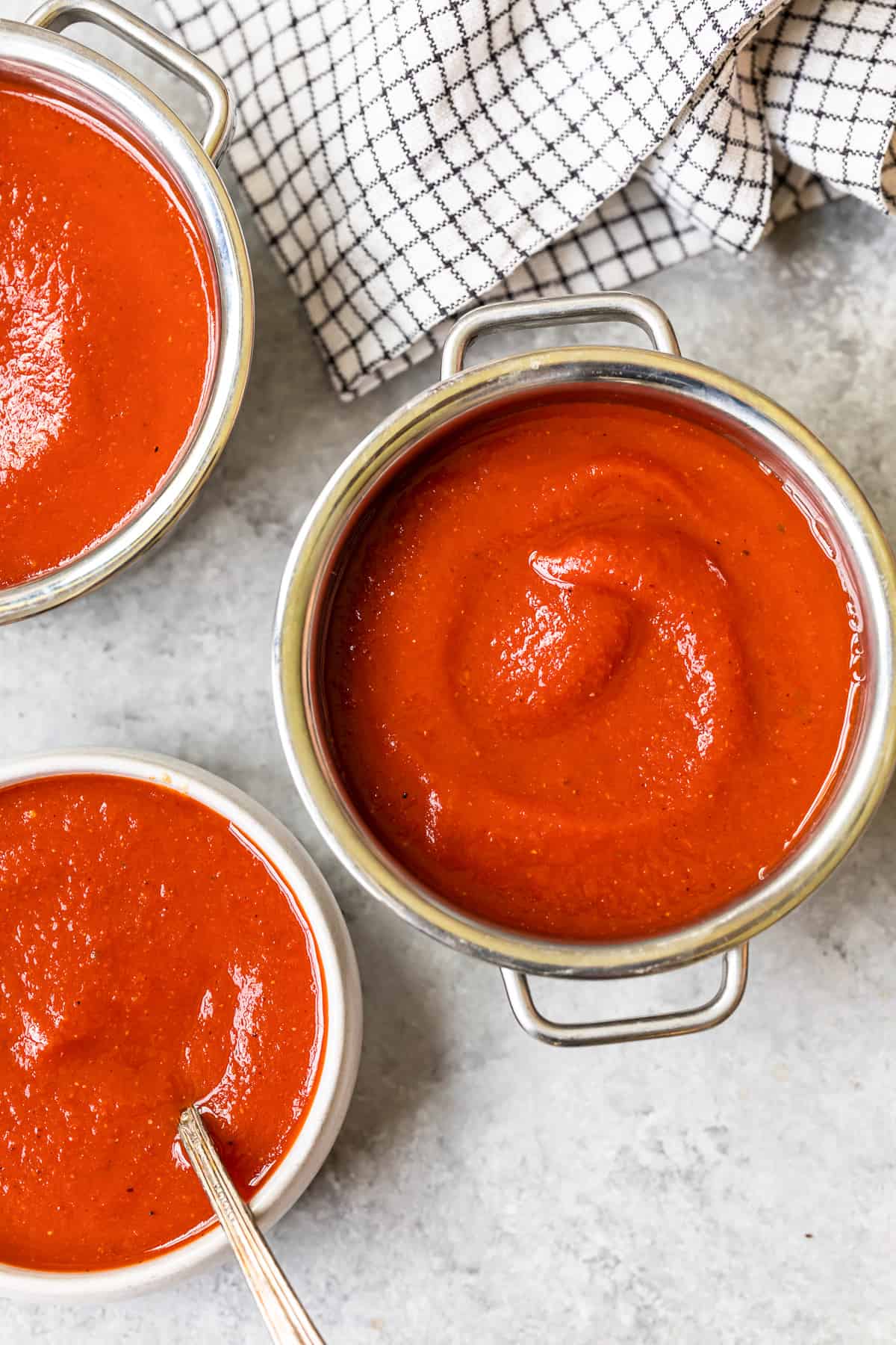 taco sauce in a pot and 2 bowls