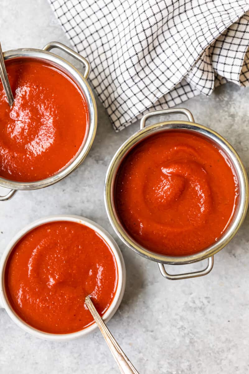 taco sauce in a pot and 2 bowls