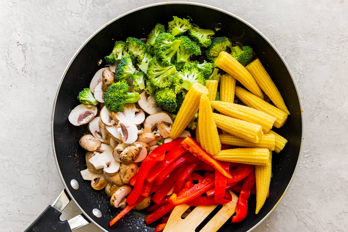 stir fry veggies in wok before cooking