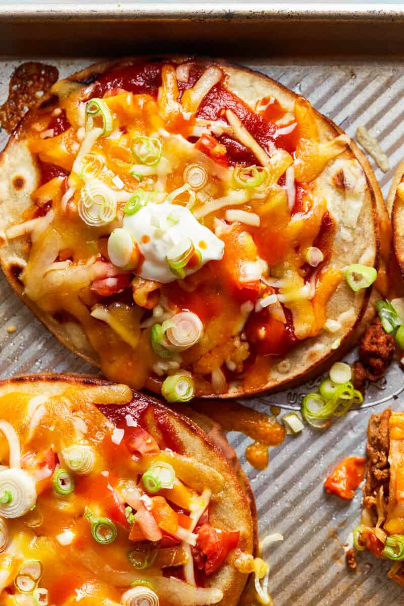 two beef mexican pizzas on baking sheet