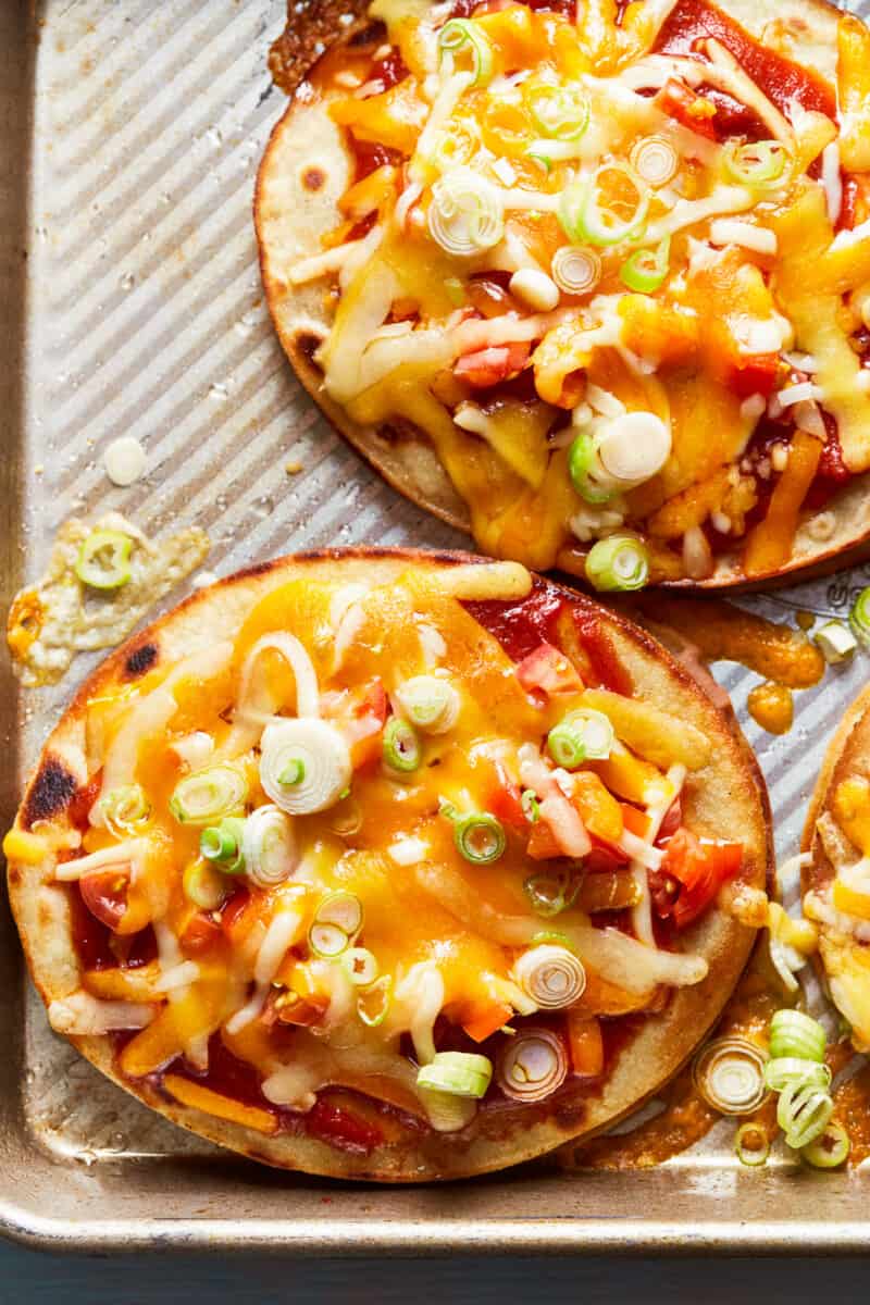 two beef mexican pizzas on baking sheet