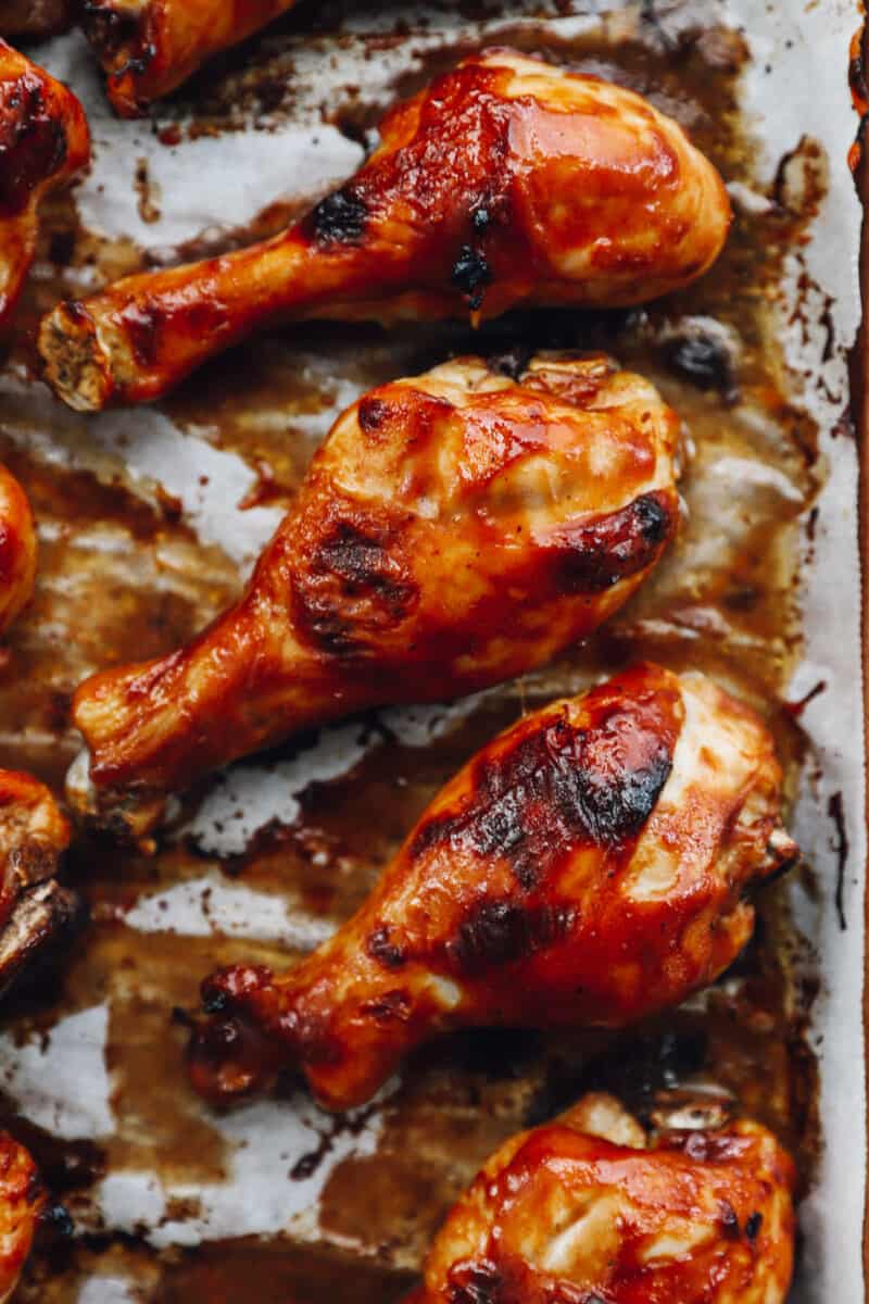 baked bbq chicken drumsticks on parchment paper