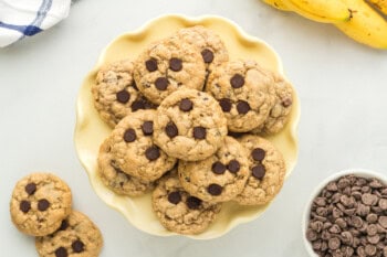 overhead image of banana breakfast cookies on a yellow plate