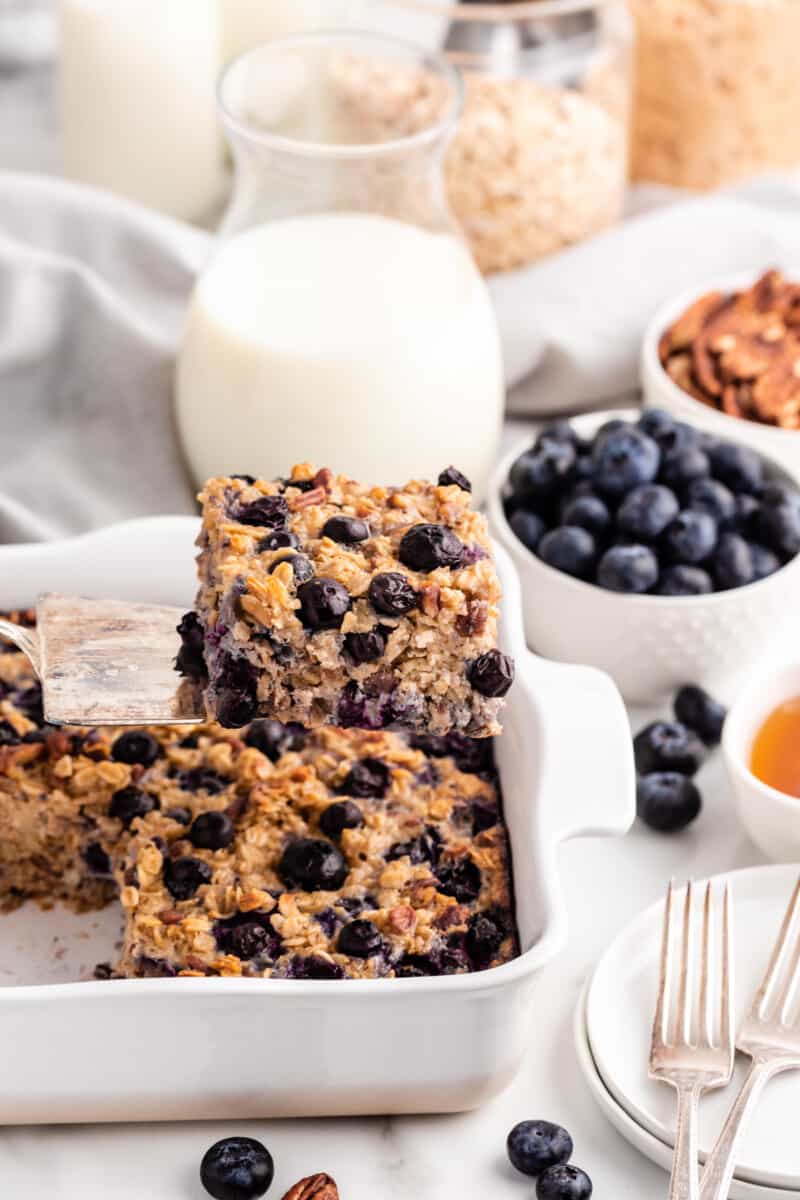 square of blueberry baked oatmeal on a spatula being removed from the pan