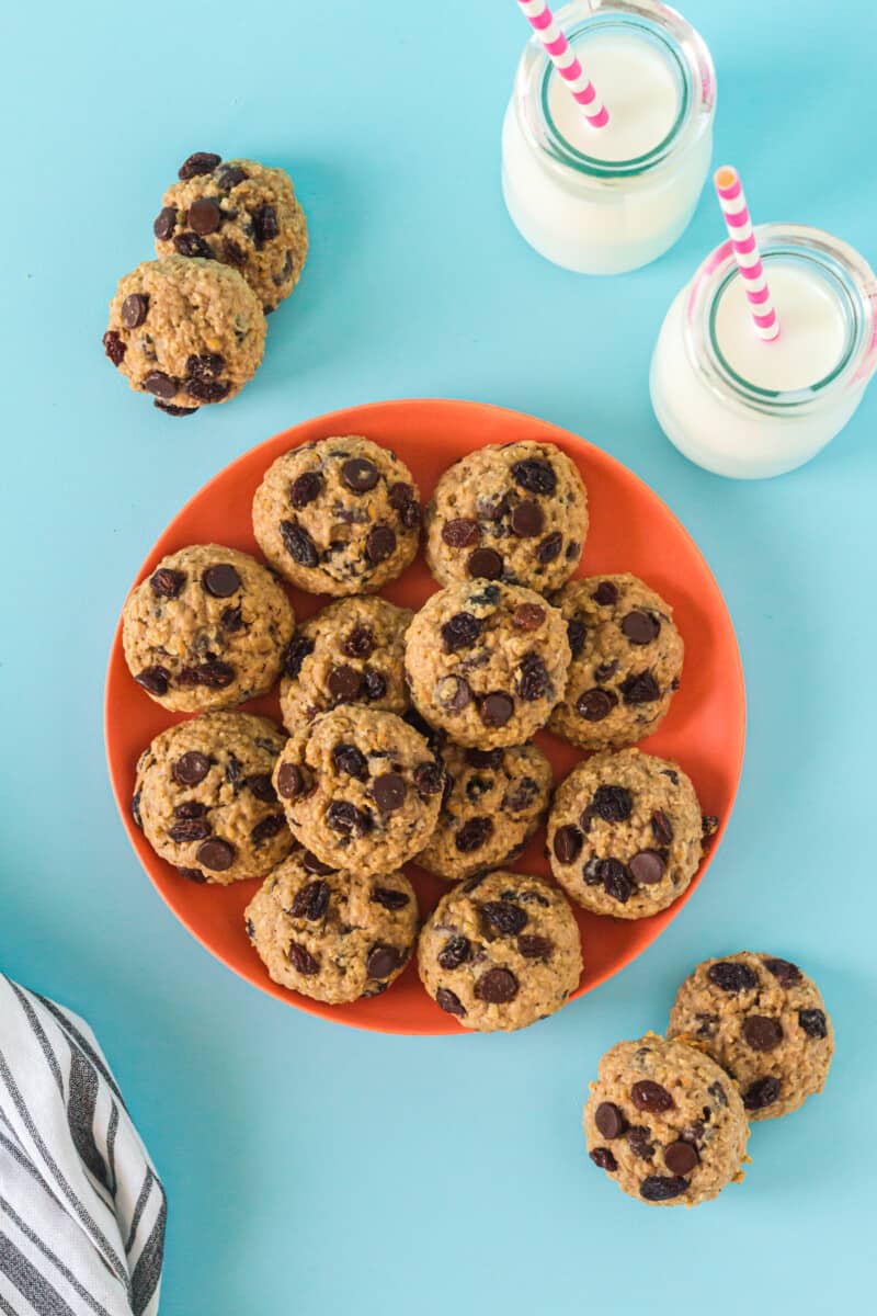 overhead image of chocolate chip breakfast cookies on an orange plate