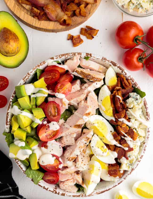 overhead image of cobb salad with dressing