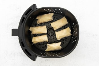 cheeseburger egg rolls in an air fryer before cooking