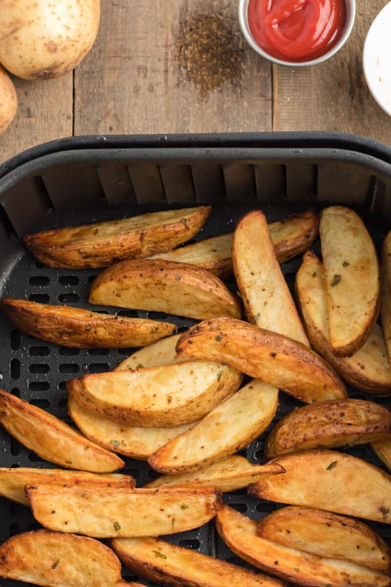 air fryer potato wedges in air fryer after cooking