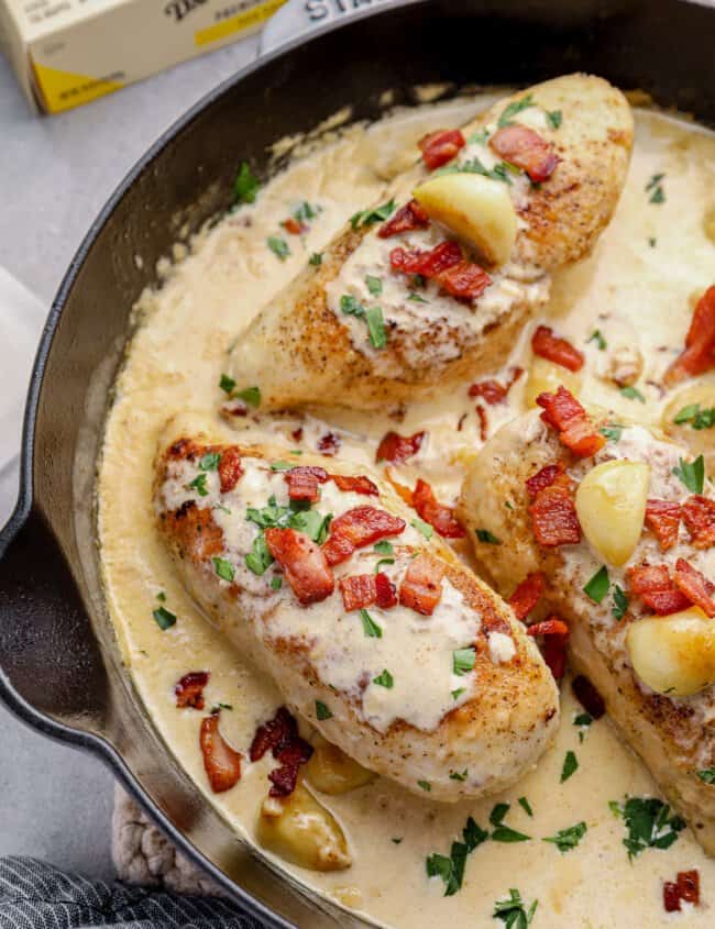 creamy garlic chicken with bacon in a skillet