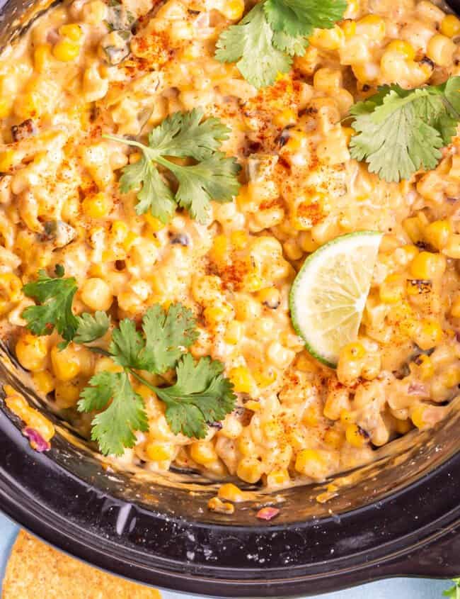 close up of crockpot corn dip in a crockpot.