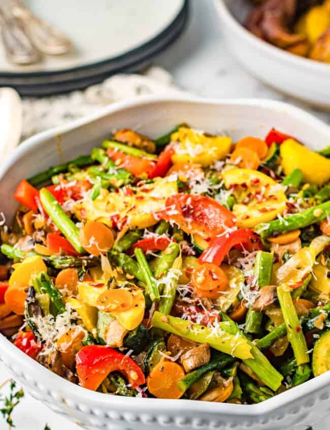 sauteed vegetables in a white serving bowl