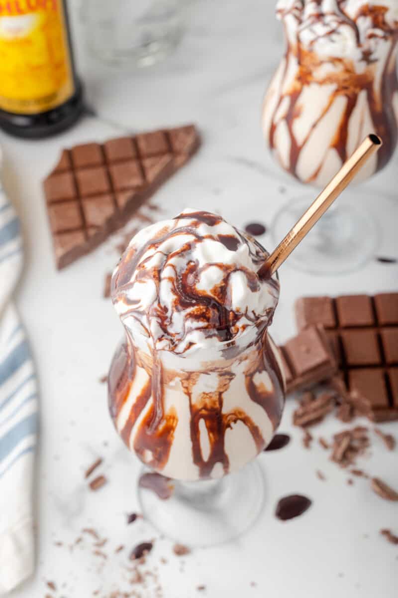 overhead view of a frozen mudslide with a gold straw.