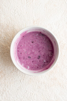 blueberry icing for blueberry pop tarts in a white bowl.