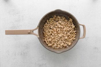 ground chicken in a frying pan.