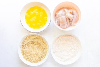 overhead view of dredging ingredients in white bowls.