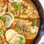 Close up of chicken piccata in a skillet.