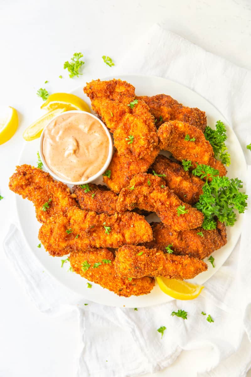 overhead view of copycat raising canes chicken fingers and sauce.