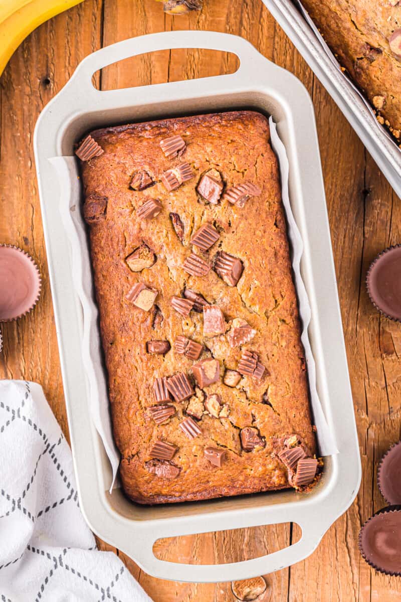 overhead view of reeses peanut butter cup banana bread in a loaf pan.