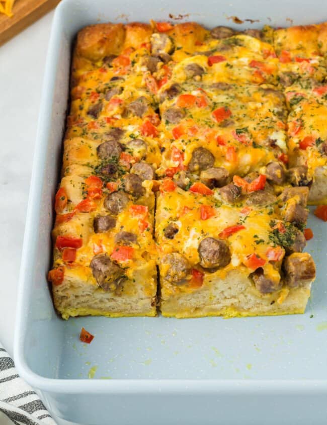 cut biscuit breakfast casserole in a baking pan.