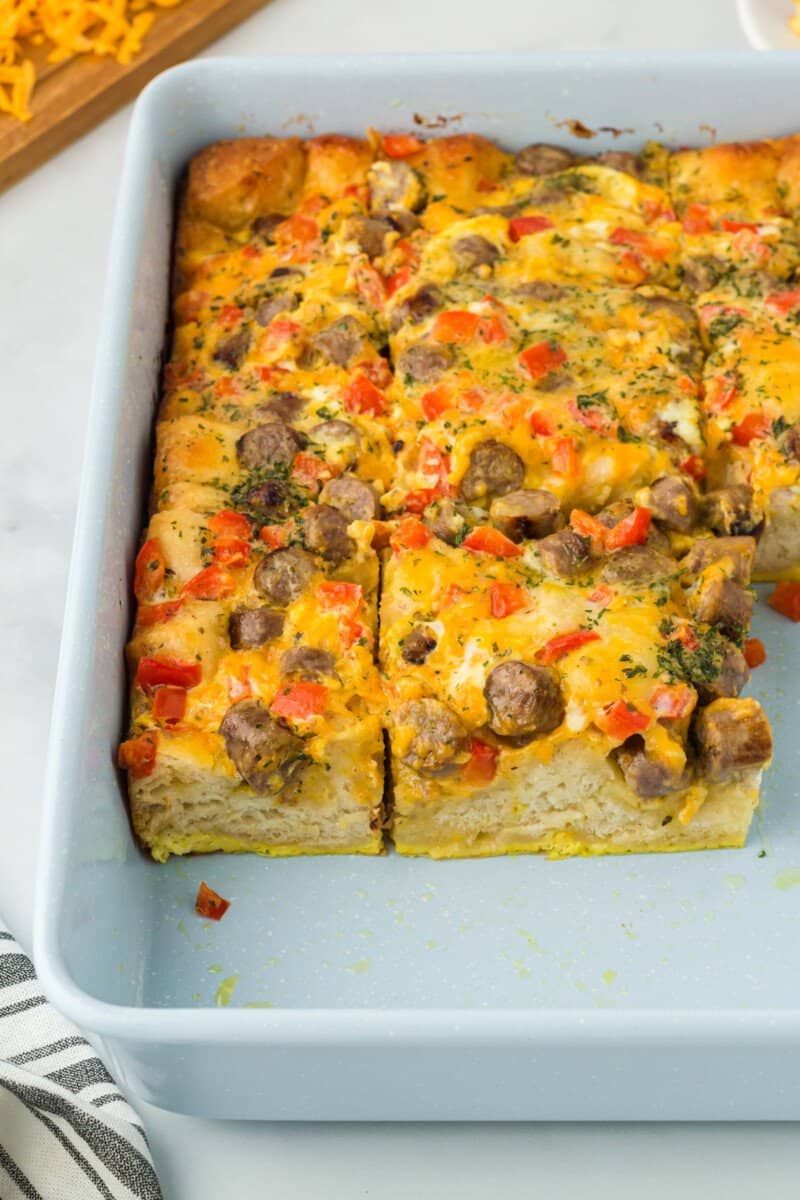 cut biscuit breakfast casserole in a baking pan.