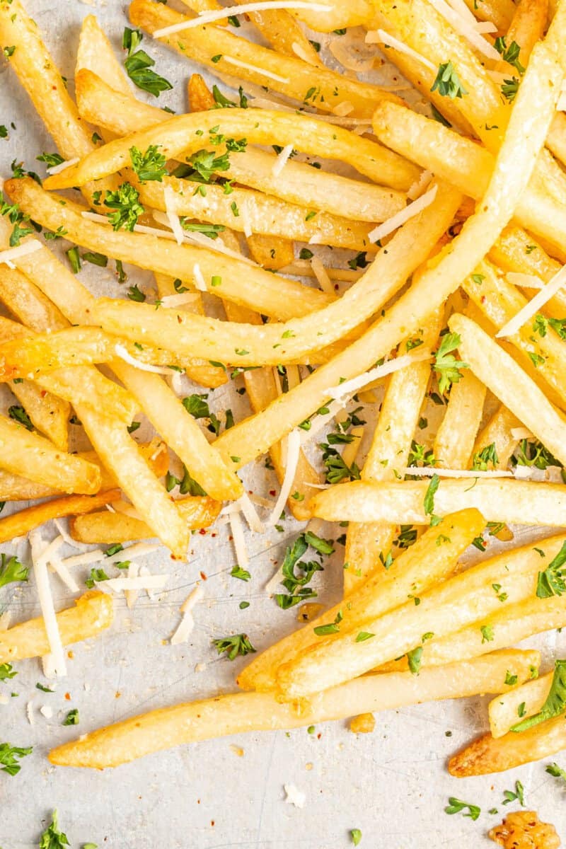 garlic parmesan fries on parchment paper.