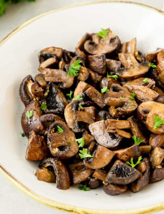 air fryer mushrooms in a white bowl.