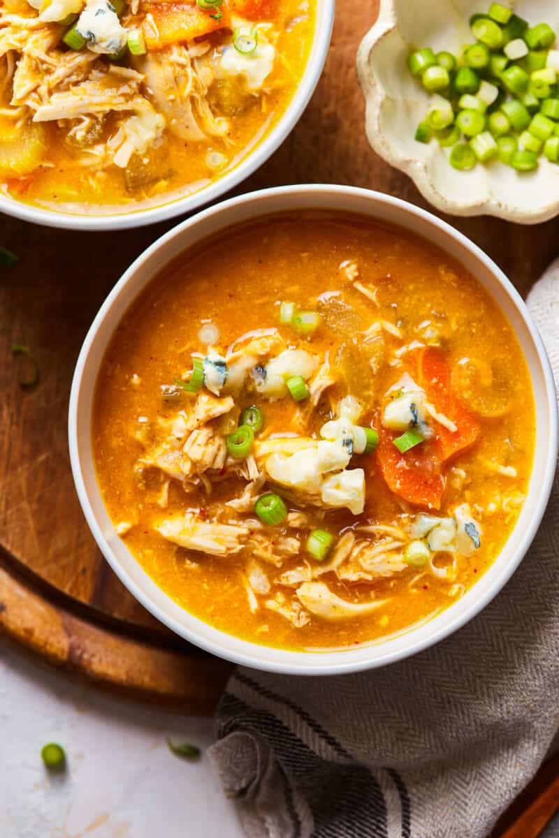 bowls of buffalo chicken soup on a table