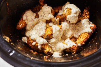 crockpot chicken wings covered in garlic parm wing sauce