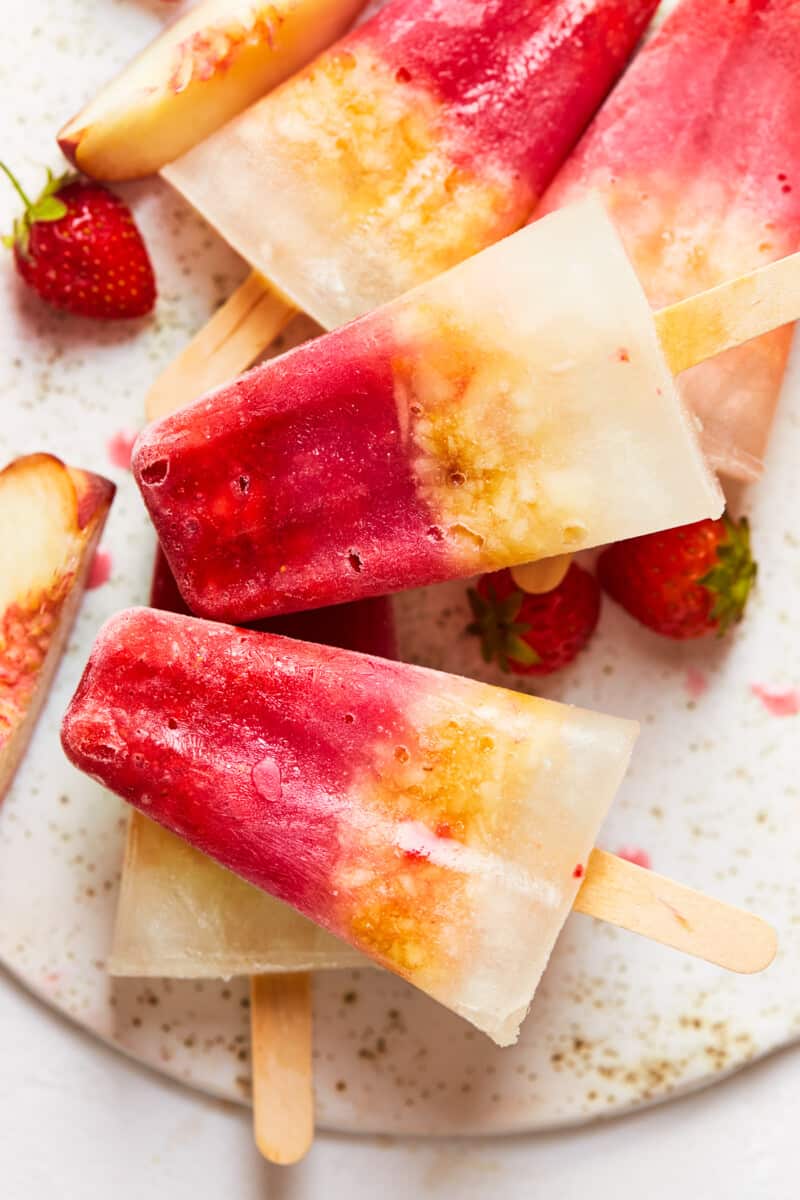 margarita popsicles stacked up on a board