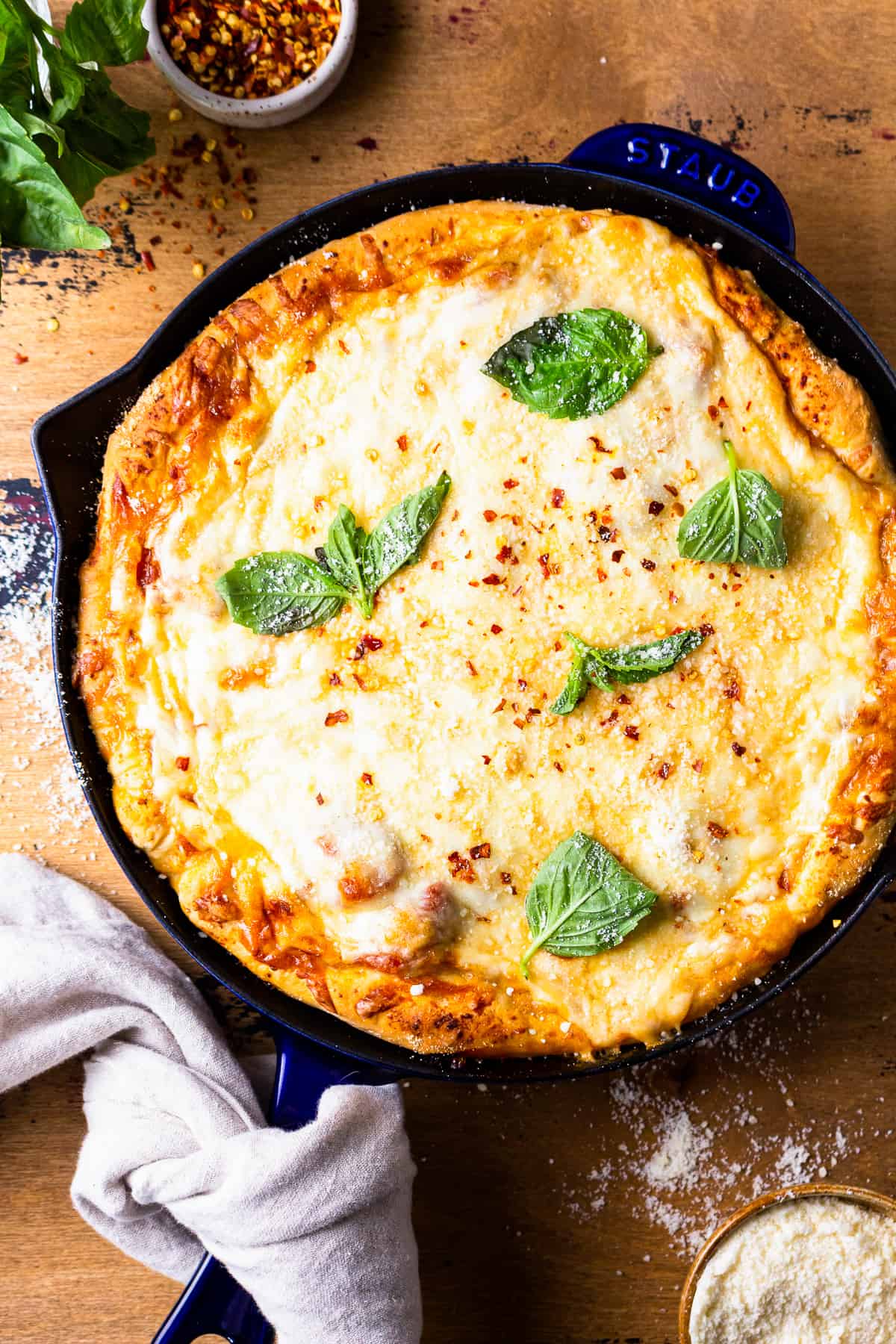 cast iron skillet pizza on a tablescape