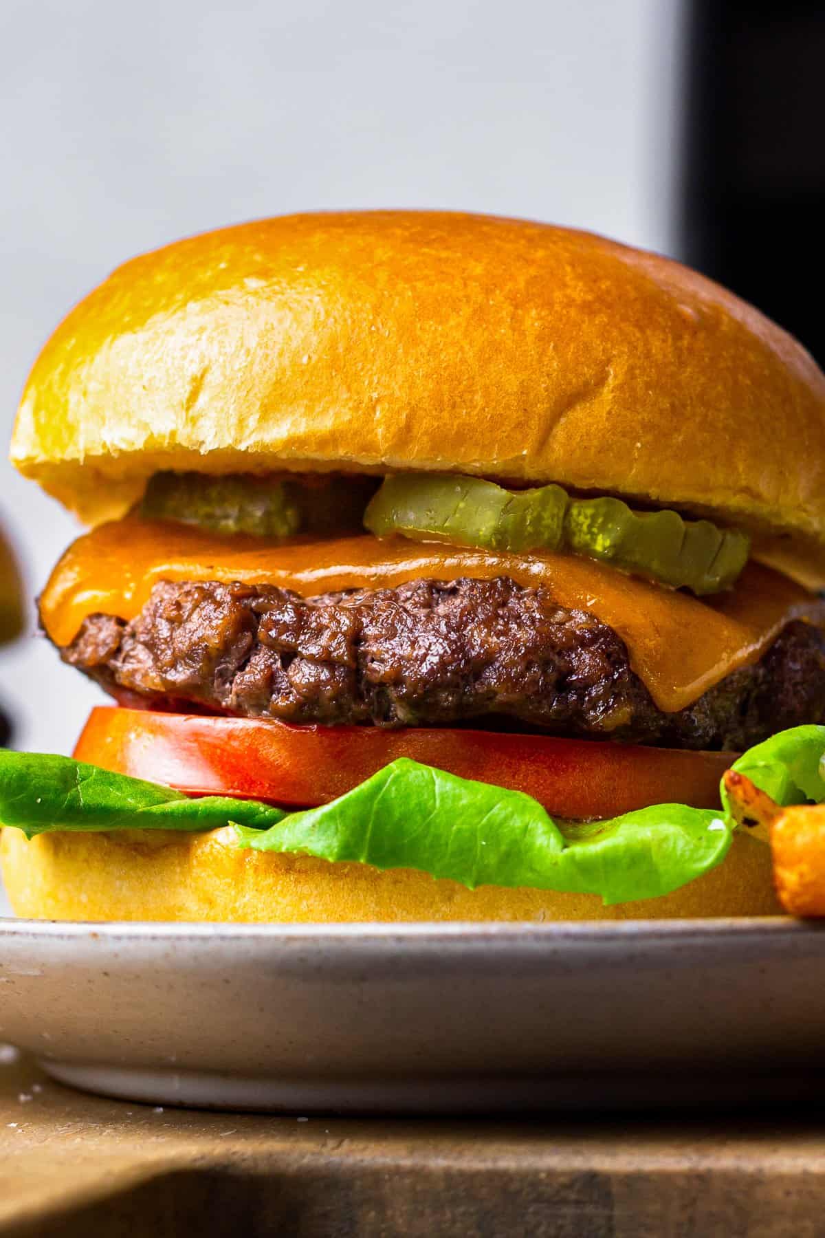 close up on an air fryer cheeseburger