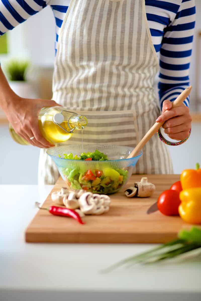 A woman wearing a striped apron.