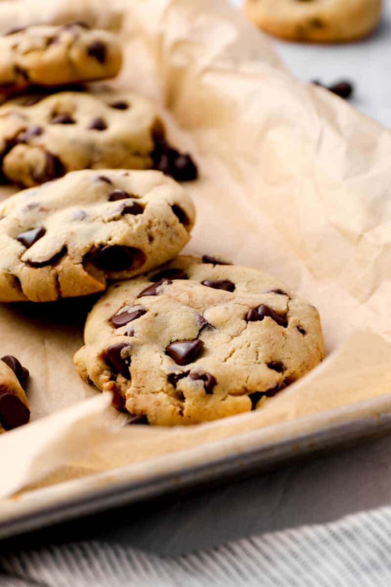 caramel stuffed chocolate chip cookies on a baking tray